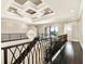 View of the elegant staircase featuring an ornate chandelier and dark wood floors at 971 Golden Bear Dr, Reunion, FL 34747