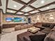 Spacious theater room with plush seating, coffered ceilings, and multiple TVs at 971 Golden Bear Dr, Reunion, FL 34747