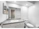Bright bathroom featuring a white vanity with gray countertop and toilet at 992 Woodrose Ct, Altamonte Springs, FL 32714