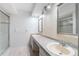 Bright bathroom features a double vanity, a shower and large vanity mirrors at 992 Woodrose Ct, Altamonte Springs, FL 32714