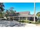 Community clubhouse with light exterior, covered entry, and well-maintained landscaping at 992 Woodrose Ct, Altamonte Springs, FL 32714