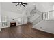 Bright and airy living room with a fireplace, ceiling fan, and staircase to the upper level at 992 Woodrose Ct, Altamonte Springs, FL 32714
