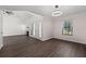 A spacious room featuring a fireplace, modern lighting, and a beautiful front door at 992 Woodrose Ct, Altamonte Springs, FL 32714