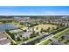 Aerial view shows the community's beautiful landscaping, pool, tennis courts, lakes, and green spaces at 10006 Quail Meadow Aly, Winter Garden, FL 34787