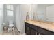 Well-lit bathroom featuring granite countertops, modern vanity, and shower-tub combination at 10006 Quail Meadow Aly, Winter Garden, FL 34787