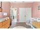 Cozy Bedroom with soft pink walls, adjacent to en suite and closet at 10006 Quail Meadow Aly, Winter Garden, FL 34787