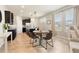 Bright dining area with a modern table set, next to kitchen island and kitchen area at 10006 Quail Meadow Aly, Winter Garden, FL 34787