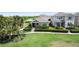 Well-maintained exterior features manicured hedges and a lush green lawn at 10006 Quail Meadow Aly, Winter Garden, FL 34787