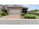 Charming single-Gathering home features a brick driveway and well-maintained landscaping at 10006 Quail Meadow Aly, Winter Garden, FL 34787