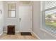 Bright entryway with tile flooring and a large window with view of the manicured yard at 10006 Quail Meadow Aly, Winter Garden, FL 34787