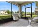 The covered patio features brick flooring and views of the neighborhood at 10006 Quail Meadow Aly, Winter Garden, FL 34787