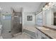 Bathroom featuring a walk-in shower, a separate tub, and elegant fixtures at 1008 W Riviera Blvd, Oviedo, FL 32765