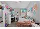 Cozy bedroom with decor, desk, and playful decorations create a personal space at 1008 W Riviera Blvd, Oviedo, FL 32765