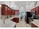 Well-equipped kitchen with ample counter space, modern appliances, and stylish tile flooring at 1008 W Riviera Blvd, Oviedo, FL 32765