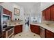 Functional kitchen layout with stainless steel appliances and easy access to other areas of the home at 1008 W Riviera Blvd, Oviedo, FL 32765