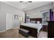 Serene main bedroom featuring a king-sized bed, and an ensuite bathroom at 1008 W Riviera Blvd, Oviedo, FL 32765