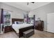 Comfortable main bedroom with large windows, direct access to the outdoors, and ample closet space at 1008 W Riviera Blvd, Oviedo, FL 32765