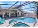 Relax by the pool and spa in this screened-in lanai, complete with dining area at 1008 W Riviera Blvd, Oviedo, FL 32765
