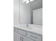 Bathroom with a large mirror, white cabinets, modern fixtures, and a white quartz countertop at 1096 Happy Forest Loop, Deland, FL 32720