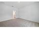 Bright bedroom featuring neutral walls, carpet, and an ensuite bathroom visible through an open doorway at 1096 Happy Forest Loop, Deland, FL 32720