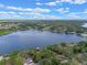 Expansive lake view highlighting the surrounding landscape and neighborhood at 1105 Lake Nettie Dr, Eustis, FL 32726
