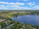 Scenic aerial view showcasing the lake and surrounding landscape at 1105 Lake Nettie Dr, Eustis, FL 32726