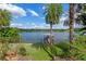 Beautiful backyard with a view of the lake and a private dock at 1105 Lake Nettie Dr, Eustis, FL 32726