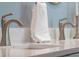 Close up of bathroom sink with elegant faucet and white countertop at 1105 Lake Nettie Dr, Eustis, FL 32726