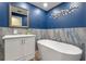 Stylish bathroom featuring a soaking tub and modern fixtures at 1105 Lake Nettie Dr, Eustis, FL 32726