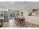 Dining area with stainless steel refrigerator and access to outdoor area at 1105 Lake Nettie Dr, Eustis, FL 32726
