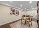 Office space features a modern desk, stylish chair, decorative accents, and recessed lighting at 1105 Lake Nettie Dr, Eustis, FL 32726