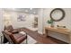 Cozy sitting area with hardwood floors, recessed lights, decorative table, and stylish chairs at 1105 Lake Nettie Dr, Eustis, FL 32726