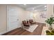 Comfortable sitting room with hardwood floors, recessed lighting, and modern furniture at 1105 Lake Nettie Dr, Eustis, FL 32726