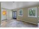 Bright sunroom with multiple windows, tile flooring, and access to the outdoors at 1105 Lake Nettie Dr, Eustis, FL 32726