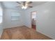 Bedroom with ceiling fan, window, and neutral carpet at 111 E Caroline St, Tavares, FL 32778