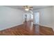 Spacious living room with hardwood floors and a ceiling fan at 111 E Caroline St, Tavares, FL 32778