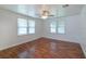 Large living room featuring hardwood floors and natural light at 111 E Caroline St, Tavares, FL 32778