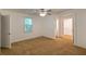 Spacious main bedroom with neutral carpet, large windows, and closet at 111 E Caroline St, Tavares, FL 32778