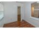 This room features hardwood floors and natural light from the windows at 111 E Caroline St, Tavares, FL 32778