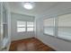 Bright sunroom with windows and a door at 111 E Caroline St, Tavares, FL 32778