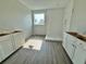 Bathroom featuring white cabinets, a shower, and a window with a view at 1157 Basalt Ln, Sanford, FL 32771