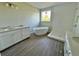 Elegant bathroom featuring a freestanding tub, dual sinks, a walk-in shower, and modern fixtures at 1157 Basalt Ln, Sanford, FL 32771