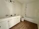 Bright bathroom offers a double vanity, white cabinetry, and a separate toilet and shower area at 1157 Basalt Ln, Sanford, FL 32771