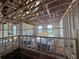 Upstairs interior with exposed rafters, insulation, and new windows at 1157 Basalt Ln, Sanford, FL 32771