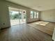 Open living room space with tile floors and a large sliding glass door to the patio at 1157 Basalt Ln, Sanford, FL 32771