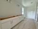 Bathroom showcasing white shaker cabinets, subway tile shower, and neutral wall color at 1161 Basalt Ln, Sanford, FL 32771