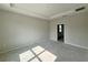 A spacious bedroom features a tray ceiling, access to the Primary bathroom, and neutral paint at 1161 Basalt Ln, Sanford, FL 32771