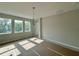 Bright dining room featuring natural light, neutral walls, elegant chandelier, and tile flooring at 1161 Basalt Ln, Sanford, FL 32771