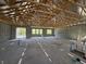 Interior of home under construction with exposed wood ceiling supports, block walls and window views at 1161 Basalt Ln, Sanford, FL 32771
