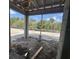 Covered patio under construction with block supports, concrete floor and backyard view at 1161 Basalt Ln, Sanford, FL 32771